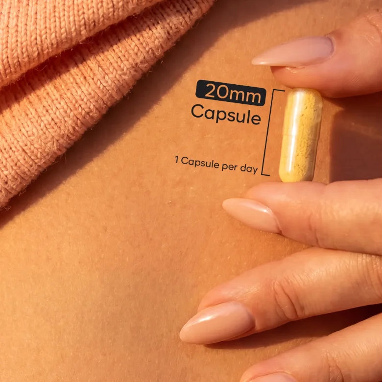 Holding a BioHerbs Berberine capsule